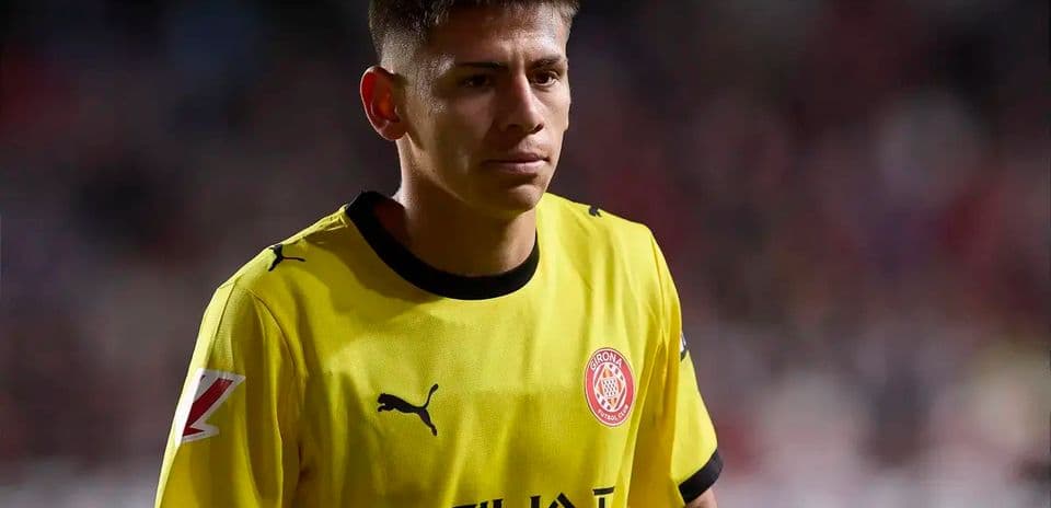 Player in yellow jersey walking on the pitch