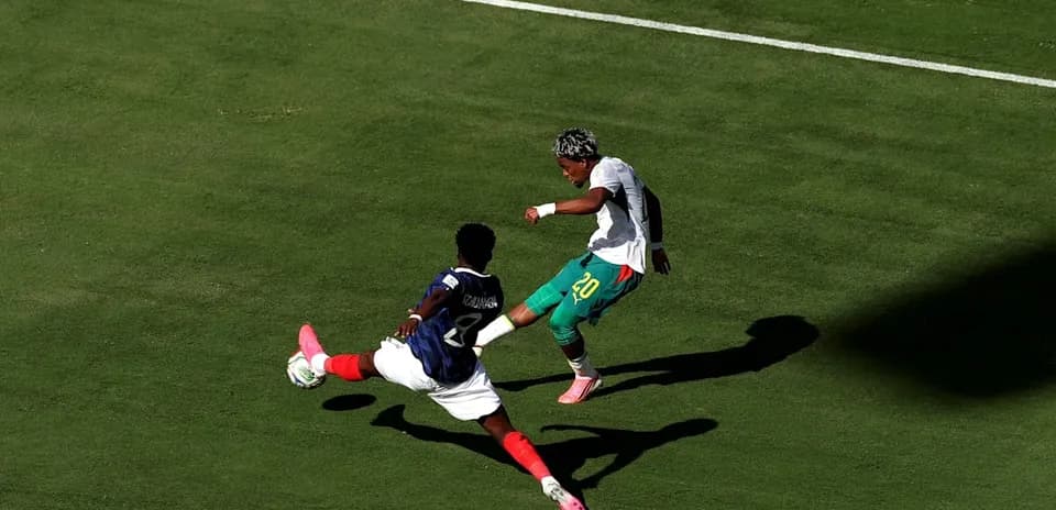 Player attempting to dribble past defender during match