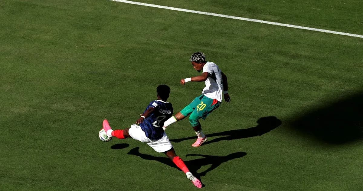 Player attempting to dribble past defender during match