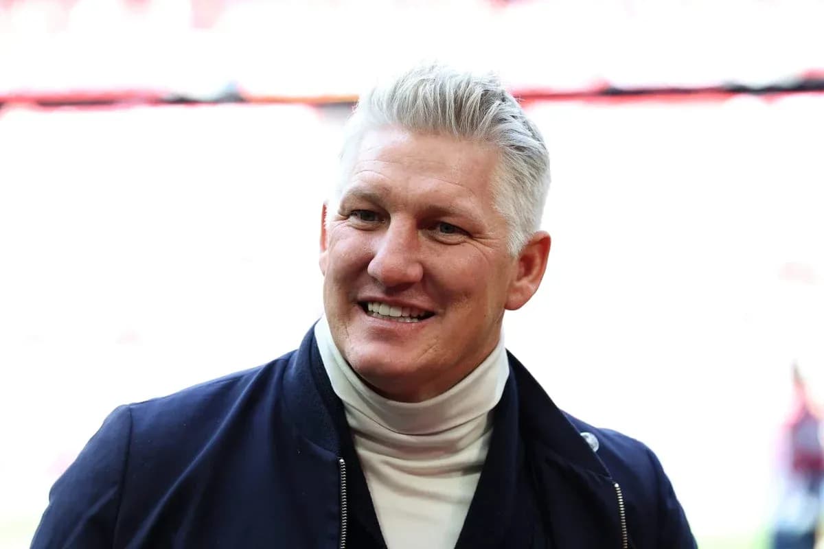 Man smiling in a sports venue setting