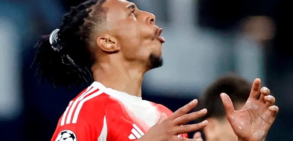 Player looking up with hands raised in match