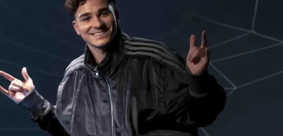 Person posing with hands in a playful gesture