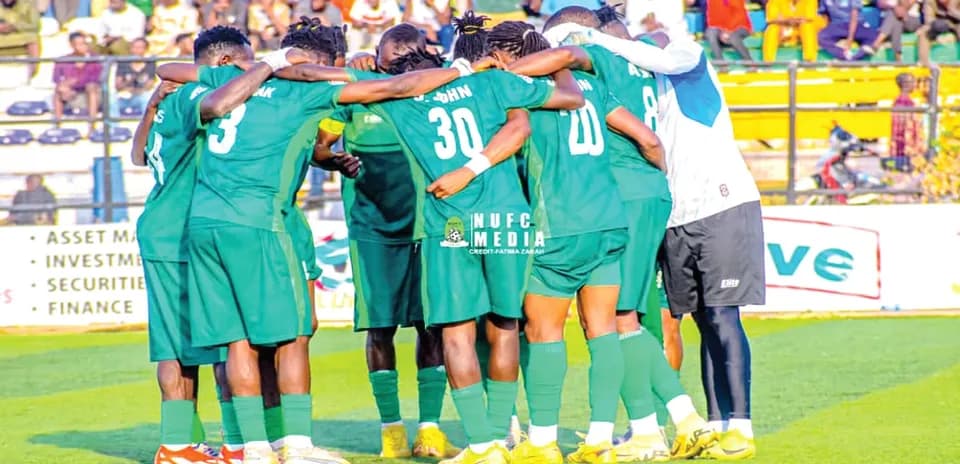 Nasarawa United players in a team huddle