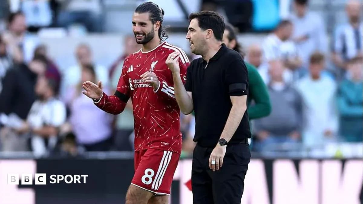 Player and coach discussing on the sidelines