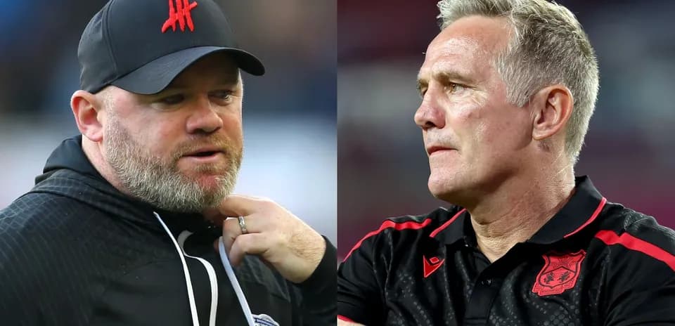 Two football managers on the sidelines during match