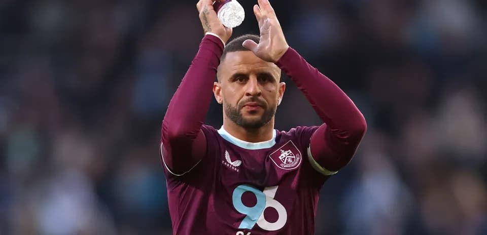 Player applauding the crowd while holding a bottle