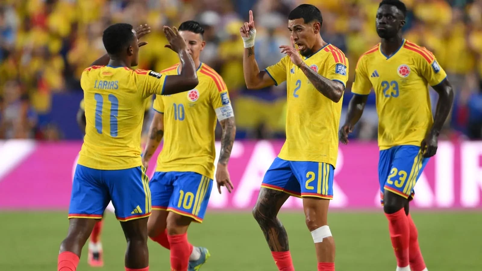 Colombian players celebrating a goal on the field