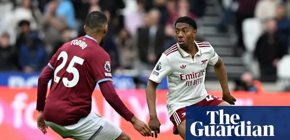 Player from Arsenal dribbling past opponent during match