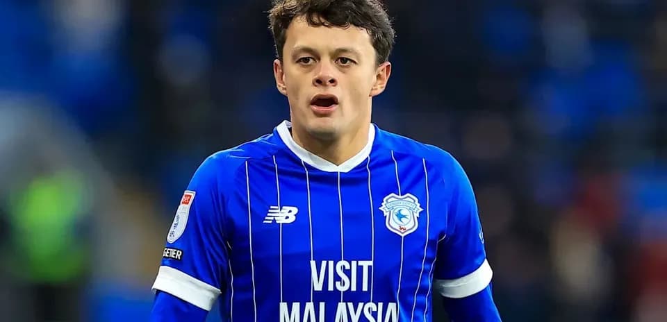 Player in blue jersey during match at stadium