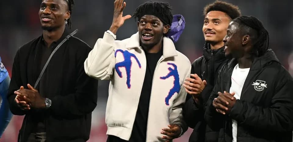 Four players smiling and interacting at event