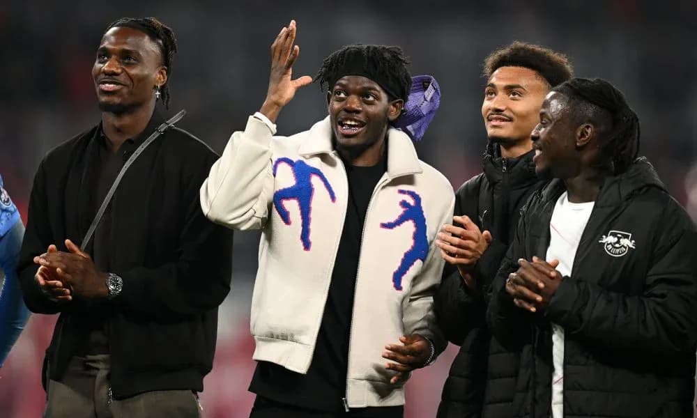 Four players smiling and interacting at event