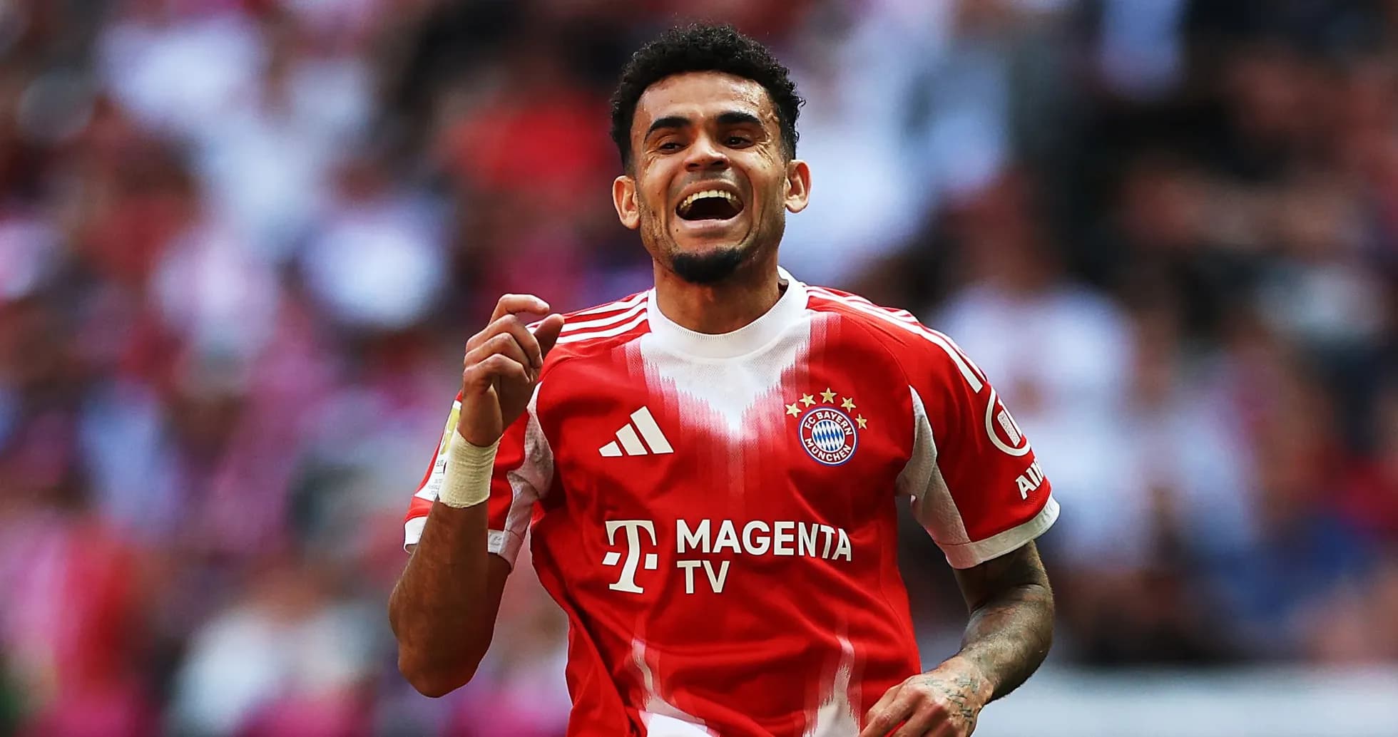 Player celebrating a goal in Bayern Munich kit
