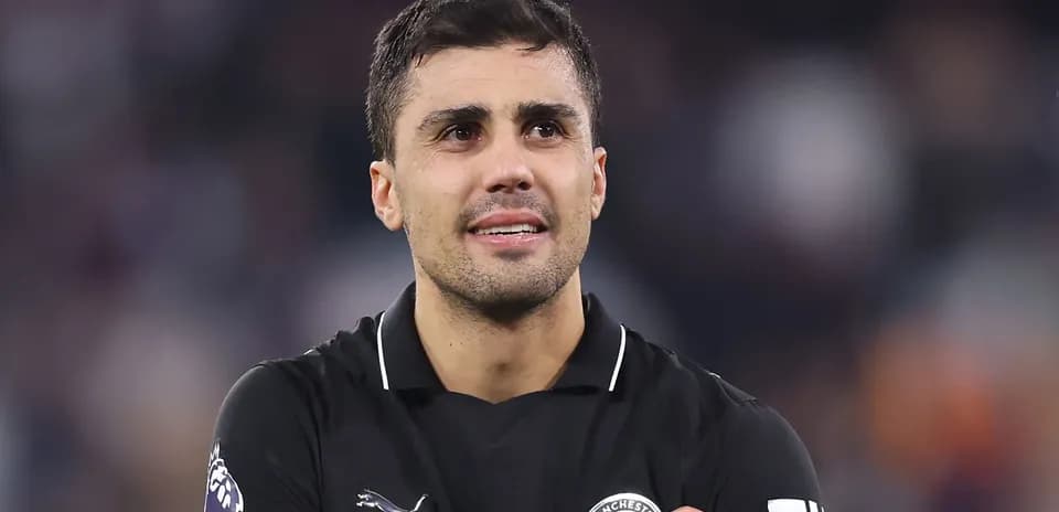 Player in black jersey celebrating after match