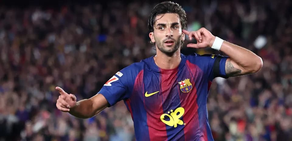 Barcelona player celebrating goal with crowd in background
