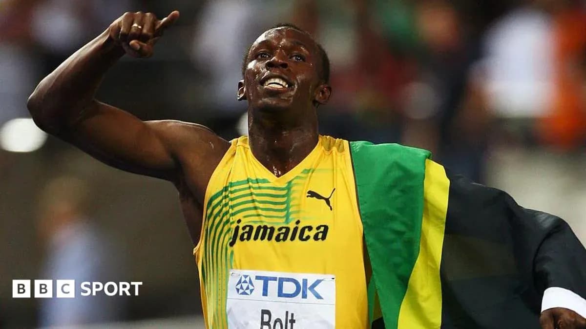 Athlete celebrating victory with Jamaican flag draped