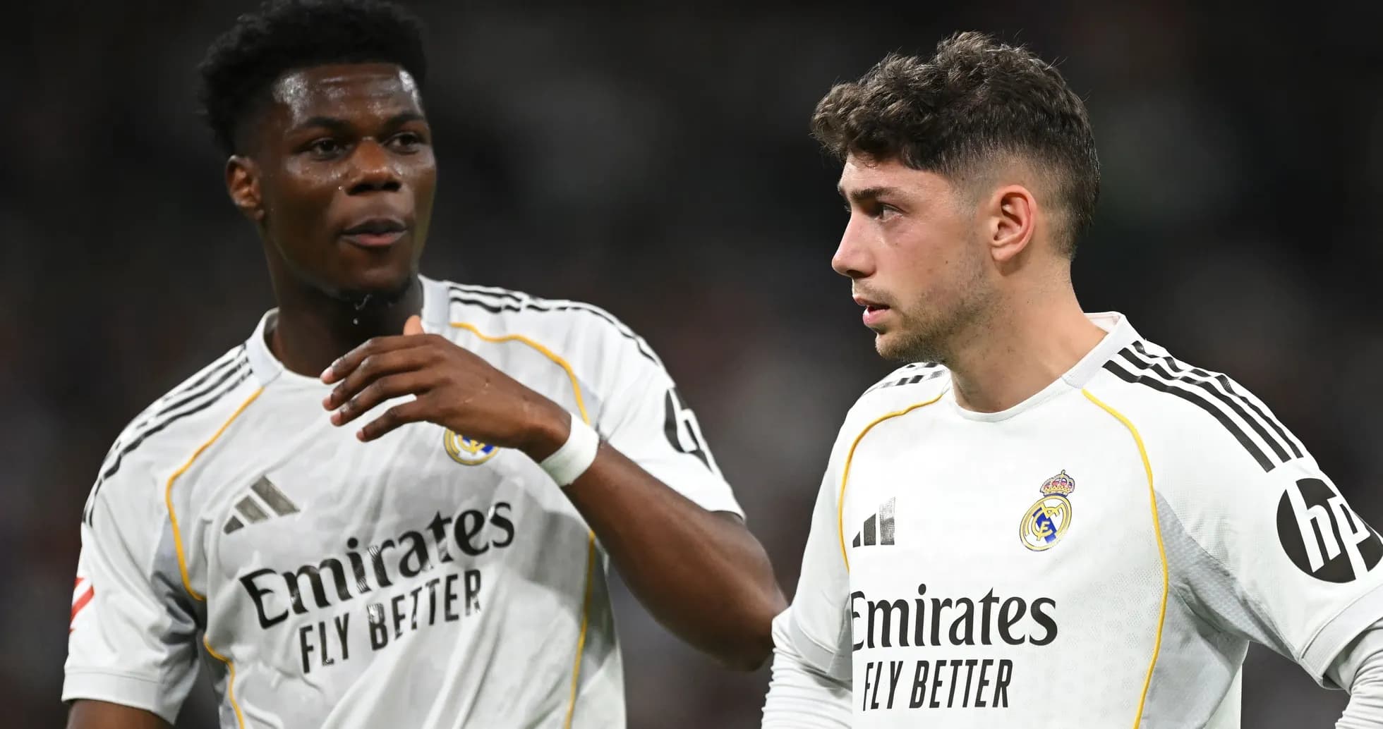 Two Real Madrid players discussing on the field