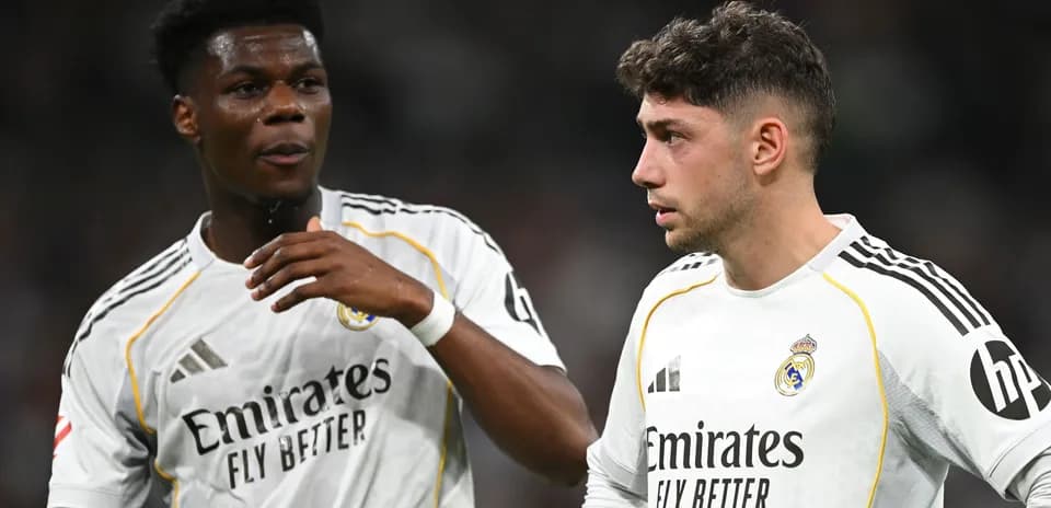 Two Real Madrid players discussing on the field