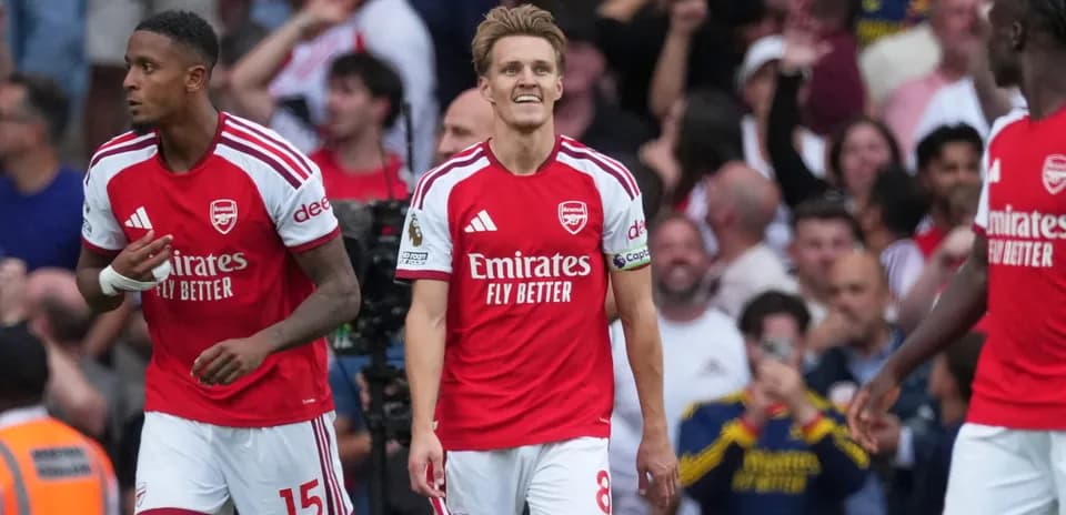 Arsenal players celebrating during Premier League match