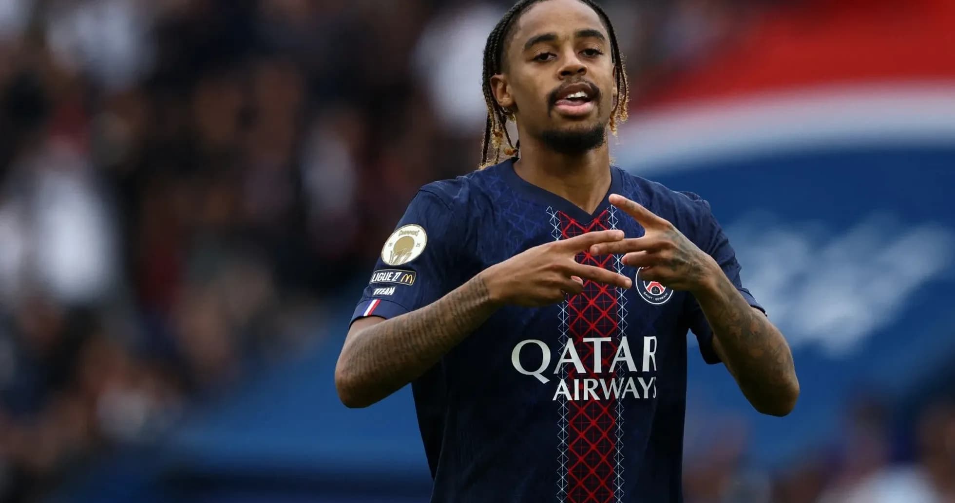 Player celebrating with hand gestures on field