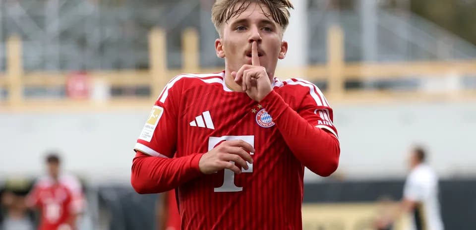 Player celebrating goal with a shushing gesture