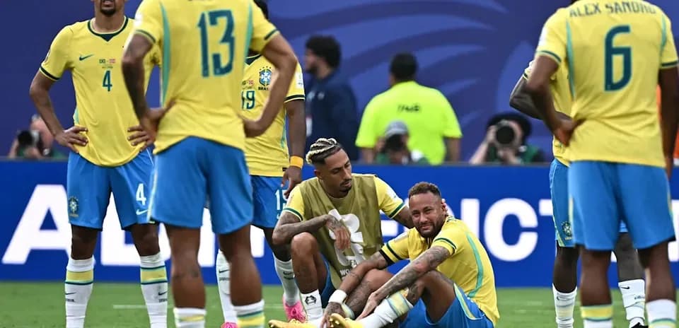 Brazilian players gathered around injured teammate Neymar