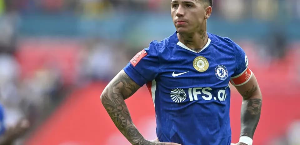 Player in blue jersey standing on the field