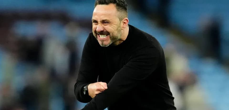 Coach celebrating enthusiastically during a match