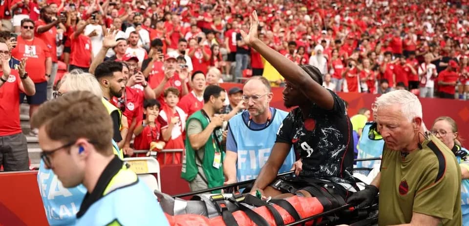 Player being stretchered off field amid crowd