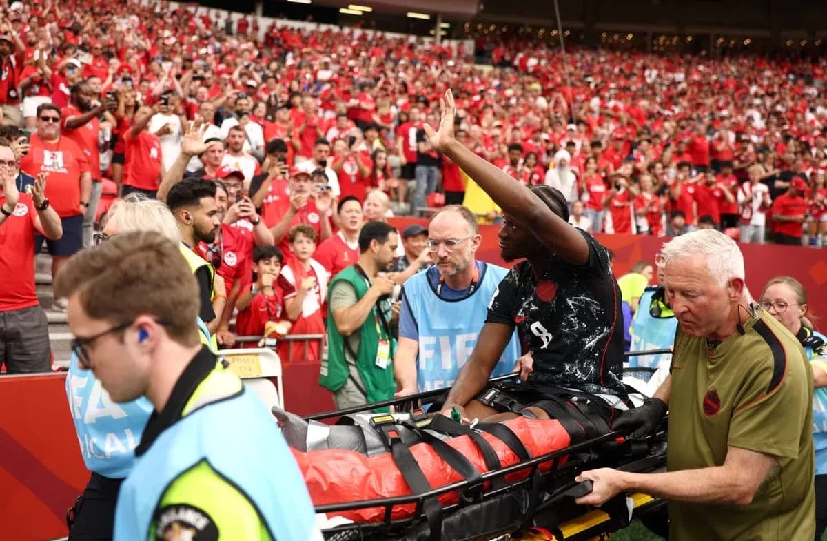 Player being stretchered off field amid crowd