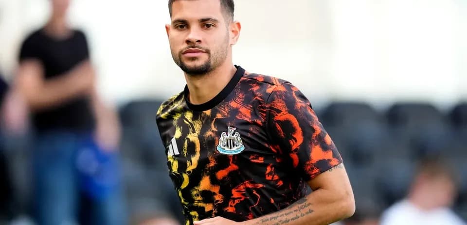 Player wearing Newcastle training kit on pitch