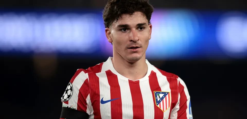 Atletico Madrid player wearing team jersey on field