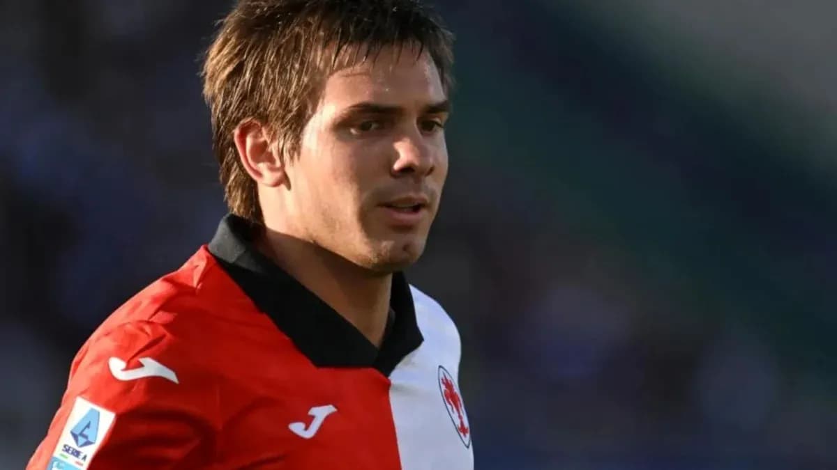 Player in red and white jersey during match