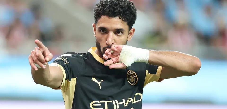 Player celebrating goal with gesture during match