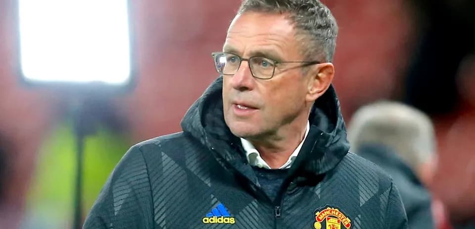 Manager in Manchester United jacket during match