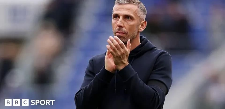 Coach applauding fans during match at stadium