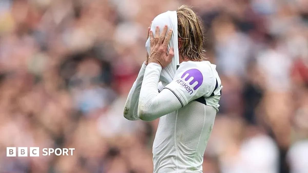 Player covering face with shirt during match