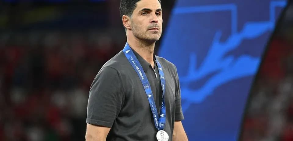 Coach wearing a medal after a match