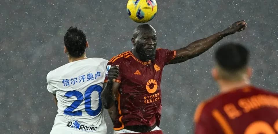 Players competing for the ball during Serie A match