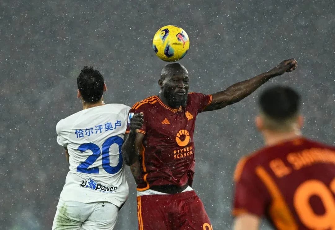 Players competing for the ball during Serie A match