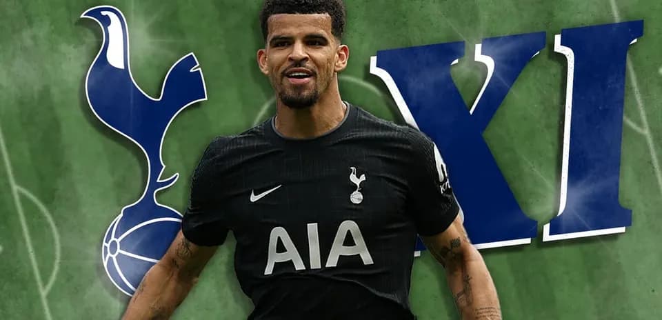 Player celebrating in Tottenham kit on green background