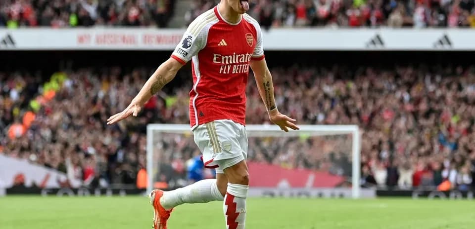 Arsenal player celebrating a goal at stadium