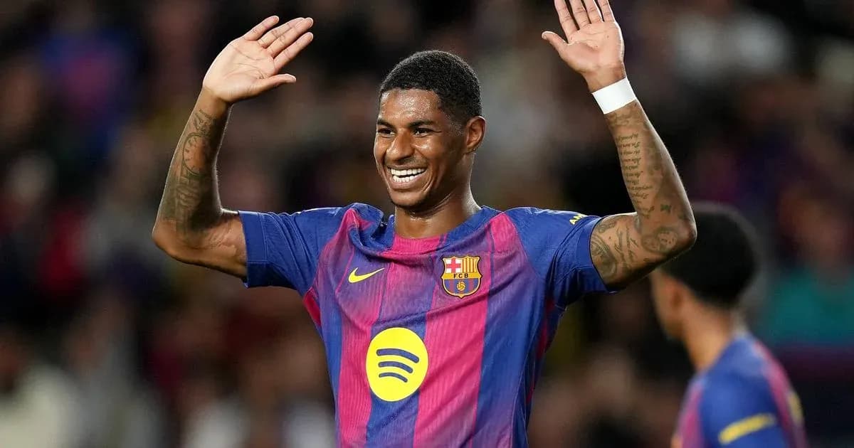 Player celebrating with raised hands on field