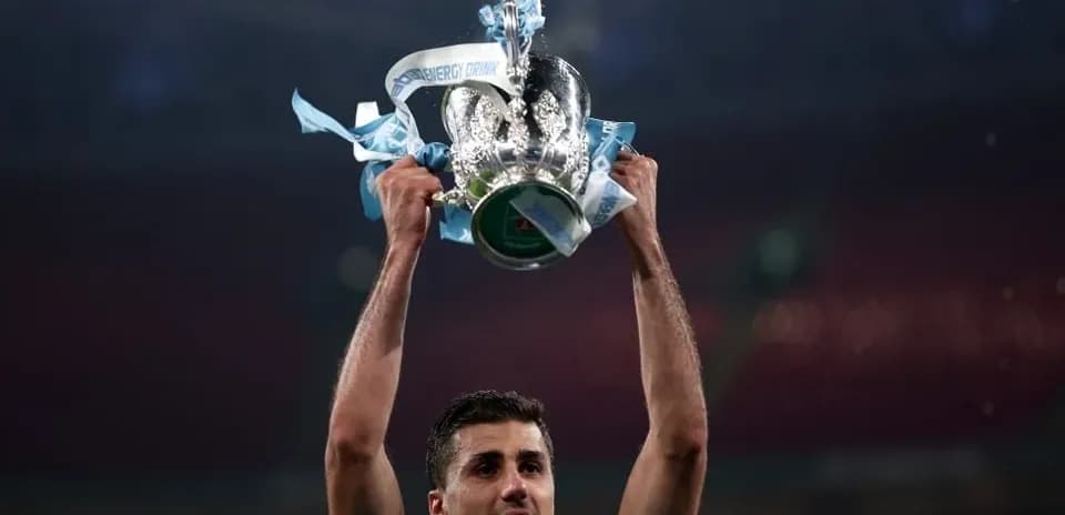 Player celebrating with trophy after winning match