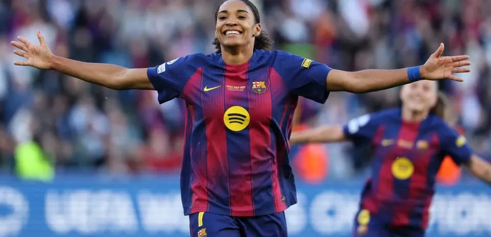 Barcelona player celebrating a goal with arms outstretched