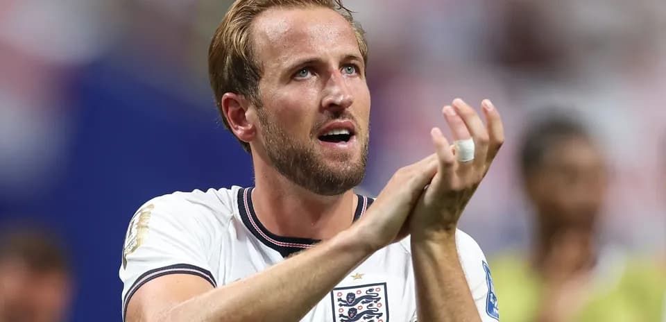 Player applauding fans after match wearing England jersey