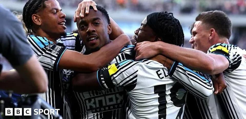 Players celebrating a goal during a match