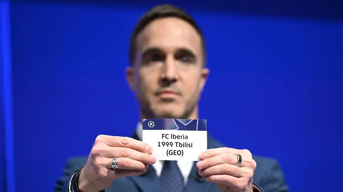 Man holding FC Iberia 1999 Tbilisi draw card Man holding FC Iberia 1999 Tbilisi draw card
