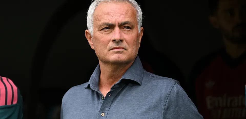 Manager observing from the sidelines during match