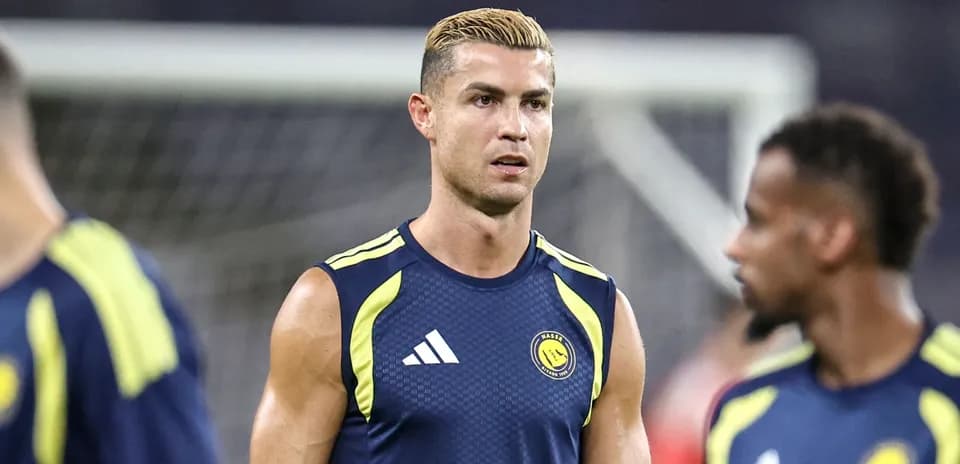 Cristiano Ronaldo training in team kit on pitch