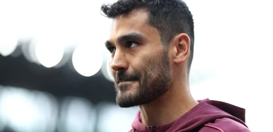 Player in maroon training gear at stadium